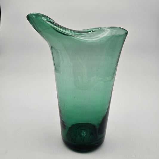 Hand blown pinched spout green glass pitcher