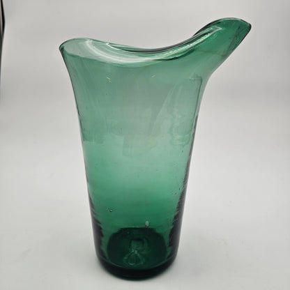 Hand blown pinched spout green glass pitcher