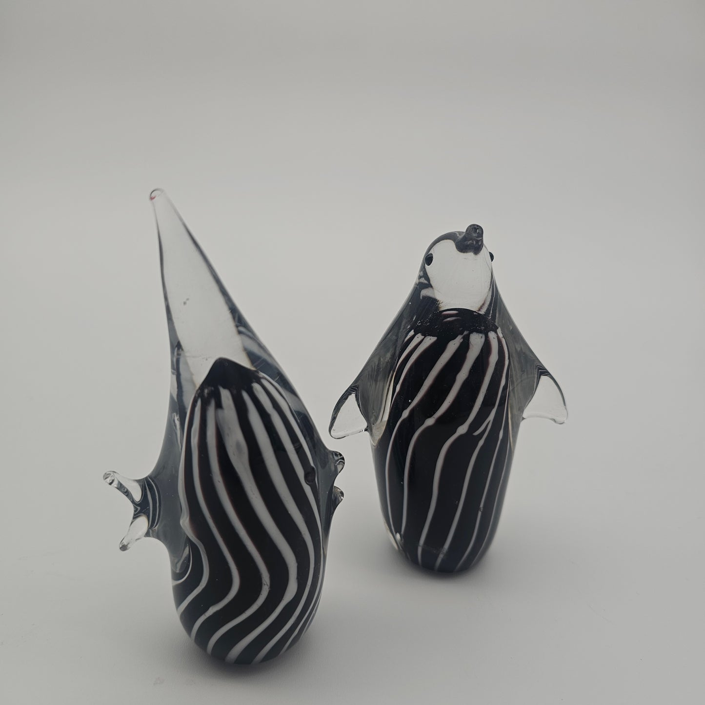 Vintage Murano style black and white penguin and fish paperweights